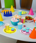Totally Vibey Under The Sea Paper Plates 7 Inch Yellow Ocean Flower Birthday Party Tableware 60 Piece Set displayed on party table.