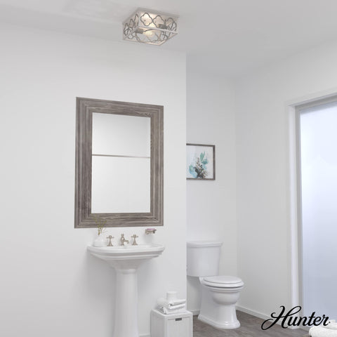 Gablecrest 2-Light Distressed White Flush Mount Ceiling Light, Dimmable, in a bathroom setting.