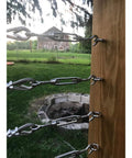 12 Pack M4 Hook And Eye Turnbuckles For Cable Rope Tension in 304 stainless steel used on garden wire against a rustic backdrop