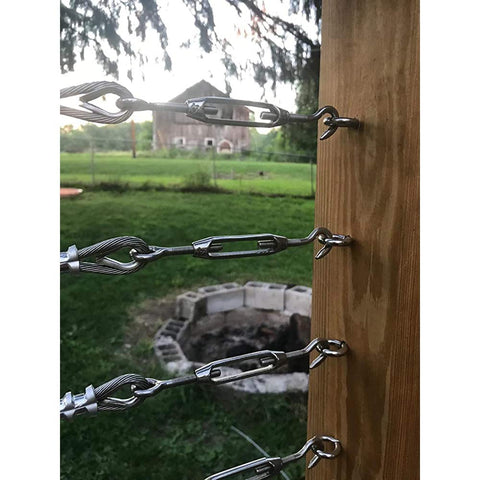 12 Pack M4 Hook And Eye Turnbuckles For Cable Rope Tension in 304 stainless steel used on garden wire against a rustic backdrop