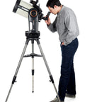 Evolution 8 EdgeHD Schmidt Cassegrain Telescope With StartSense And StarBright XLT Coatings in use by an astronomer with tripod
