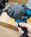 Close-up of Heavy Duty 1000Nm Electric Brushless Shock Torque Wrench For Cars held in hand, showing the drive socket.