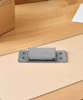 Concealed Adjustable 5 Inch Silver Door Hinge For Wooden Cabinets And Secret Bookcases, shown on a wooden surface with four screw holes.