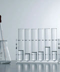 Six Well Lab Stand Holder Clear Acrylic Tube Rack For Ten Milliliter Centrifuge Tubes next to beaker and pipette