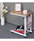 Grab And Go Rolling Laptop Desk Stand With Locking Wheels Adjustable Mobile Workstation Table For Bed Couch Gaming Or Living Room Smooth Ride Chill Spot Flat Surface with oak top and magazines.