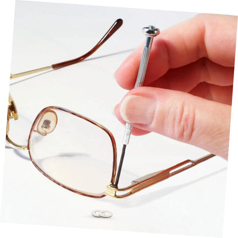 Hand using tool on rimless glasses with metal eyeglass screw washers set, 200 pcs rimless glasses gaskets and frame tighteners.