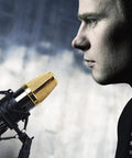 Universal 50mm Microphone Shock Mount And Clip Holder For 48 To 54mm Condenser Mics in use with a condenser mic on a stand