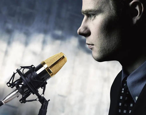 Universal 50mm Microphone Shock Mount And Clip Holder For 48 To 54mm Condenser Mics in use with a condenser mic on a stand