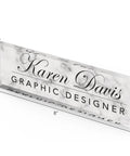 Personalized Desk Name Plate With White Marble Look On Clear Acrylic, showing name and title "Karen Davis, Graphic Designer", 8x2.5"