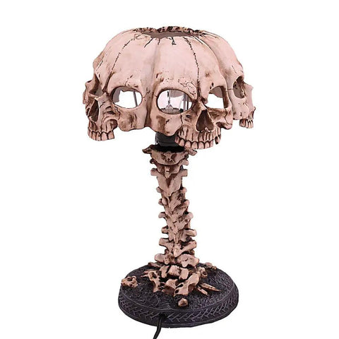 Close-up of Light Up Skeleton Table Lamp With Four Bone Skull Design, LED 3D Skeleton Night Light on resin base, spooky home decor.