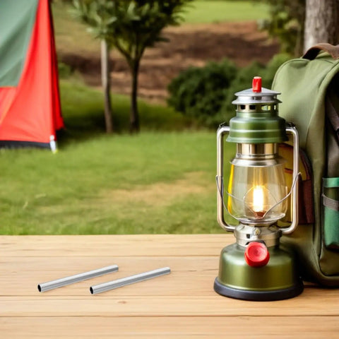 Five Pack Aluminum Tent Pole Repair Sleeves Replacement Connectors placed next to a camping lantern on a wooden table outdoors.