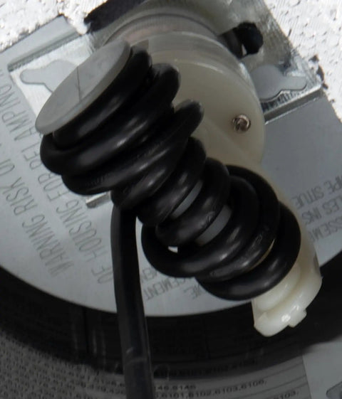 Close-up of the E26 socket and coiled wiring in the Slick Six Inch Recessed Can To Instant Pendant Light Conversion Kit.