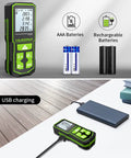 Workhorse Laser Distance Meter with 328 ft Range, dual display, batteries shown, charging with USB cable on wooden surface