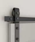Close-up of heavy duty bi-fold barn door hardware kit with side mounted rollers on steel track, no doors, quiet sliding mechanism.