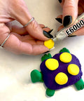 Craft Adhesive 4 Pack 0.18 Oz Tubes With Five Minute Open Time, gluing decoration on purple and yellow turtle model