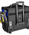 Back view of Big Rolling Tool Storage Bag Case With Wheels, showcasing heavy-duty telescoping handle, hand tools visible in pockets