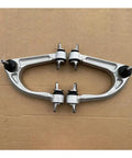Front Upper Control Arm Kit For McLaren MP4 12C 625C 650S 3 8L V8 with OEM precision, shown with replacement bushings on cardboard.