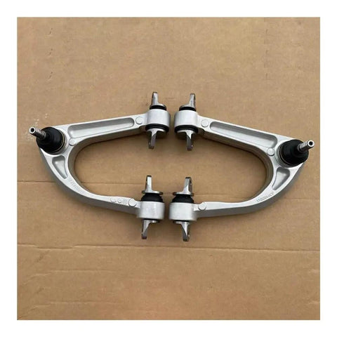 Front Upper Control Arm Kit For McLaren MP4 12C 625C 650S 3 8L V8 with OEM precision, shown with replacement bushings on cardboard.