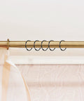 Heavy Duty Zinc Alloy Shower Curtain Rings Set, black hooks on gold rod, smooth glide O rings, easy mount for bathroom rods and curtain tracks.