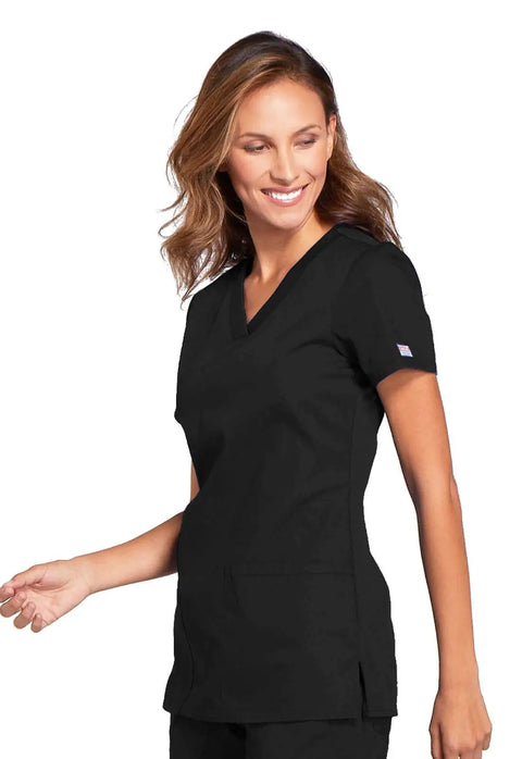 Woman wearing Women's Slim Fit V-Neck Scrub Top With 3 Pockets And Instrument Loop, Fade-Resistant Fabric, All-Day Stretch Knit, Black, Size M