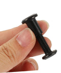 Heavy Duty 10 Pack Countersunk Binding Screws And Barrel Nuts For Furniture Hardware And Photo Album Crafting With Dang Solid Metal Construction And Sweat Free Assembly For Everyday Diy Tasks, close-up view of a black binding screw in hand.