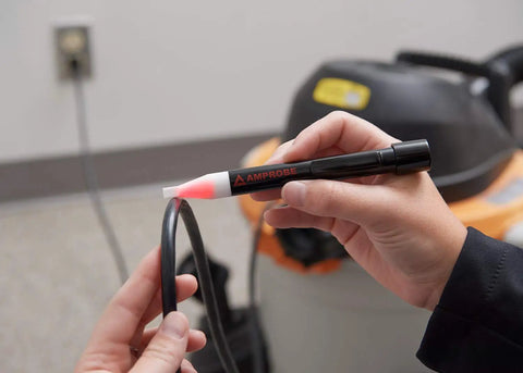 Person using VP 440 Non Contact Voltage Detector For Detecting 50 To 1000V AC With Safe Insulated Probe on cable