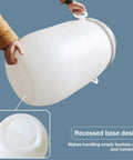 Person holding White HDPE Water Storage Barrel With Latch Ring Lid, Food Grade Plastic, showing impact resistant design