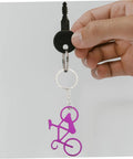 Person holding Everyday Carry Bottle Opener Keychain With Bicycle Pendant Multipurpose Lightweight Metal Lid Lifter For Bar And Car Keys