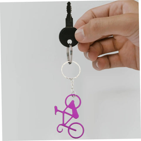 Person holding Everyday Carry Bottle Opener Keychain With Bicycle Pendant Multipurpose Lightweight Metal Lid Lifter For Bar And Car Keys
