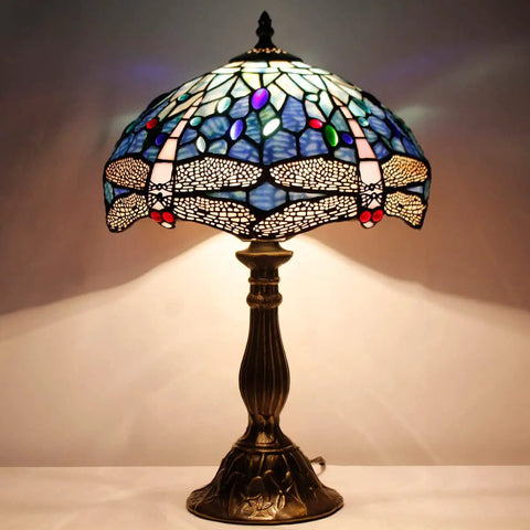 Tiffany Style Dragonfly Blue Stained Glass Table Lamp For Desk And Bedside Reading Light With Antique Green Bronze Base Delivers A Cozy Vibe And Soft Warm Glow For Living Room Bedroom Or Home Office Decor.