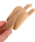 Hand holding a Wooden Door Stopper With Cute Decorative Funny Shape Prevents Doors From Hitting Walls Easy To Install No Tools Needed For Home