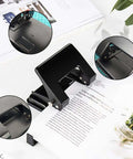 Heavy-Duty 2-Hole Punch Handheld Paper Punch for 20-Sheet Capacity With 50 Percent Less Effort and Built-In Waste Tray in use.
