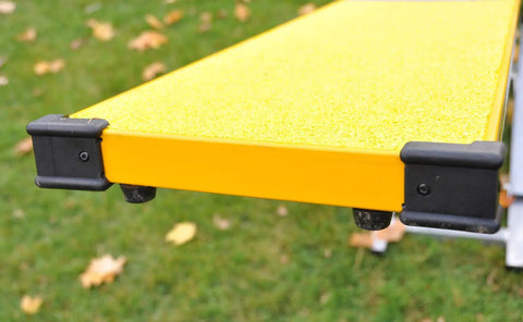 Beefy Durable Aluminum And Steel Dog Teeter Board with yellow rubber skin and black ends, 12-inch wide surface for agility training.