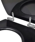 Close-up of dual pack toilet seat set featuring silent soft close lids with chrome hinges, matte black finish.