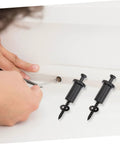 Installation of Four Piece Carbon Steel Sliding Barn Door Spacers with screws, showing hands using a screwdriver for wall track assembly.