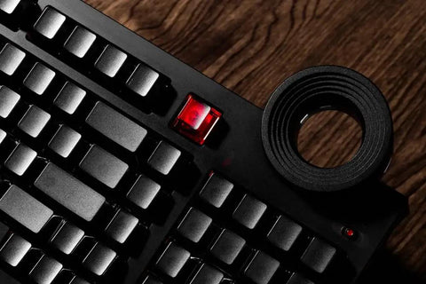 98 Key Silent Mechanical Keyboard With Hot Swappable RGB Lighting And Tri Mode Wireless Setup showing black keys and glowing red keycap.