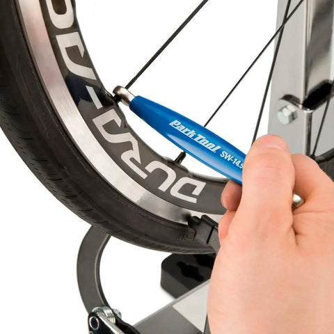 Spoke Wrench For Shimano Wheel Systems SW14.5 3.75mm 4.4mm Blue Pro Grade Bike Repair Tool in use on a bicycle wheel
