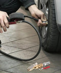 Straight Up Slick Lock On Tire Inflator Chuck Quick Release Valve Heavy Duty Air Compressor Hose Adapter Nozzle Swivel Hookup for Car SUV E V Truck Rig in use inflating a tire.