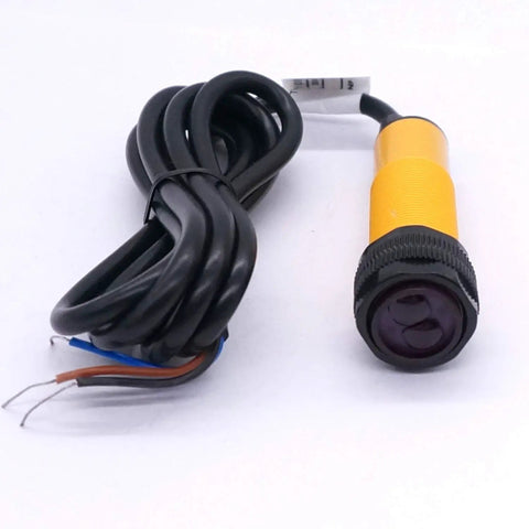 Photoelectric Sensor Adjustable 30 Cm Sensing Range M18 Diffuse Reflection Proximity Switch lying on surface