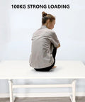 Rock Solid Manual Standing Desk With Easy Crank Adjustment Ergonomic Sit To Stand Workstation Table with a person sitting on top