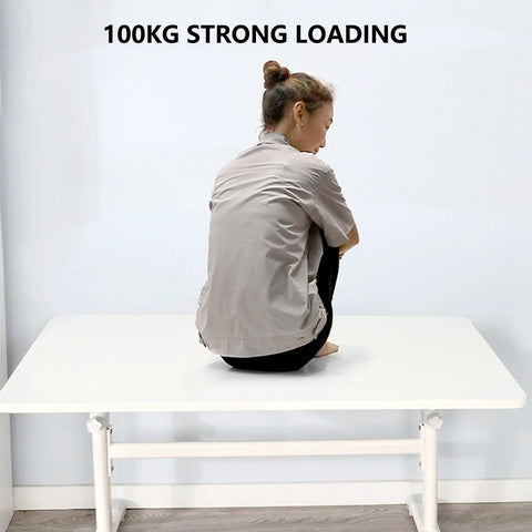 Rock Solid Manual Standing Desk With Easy Crank Adjustment Ergonomic Sit To Stand Workstation Table with a person sitting on top