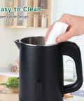 Hand cleaning inside Portable Stainless Steel Electric Kettle 0.8L Mini Hot Water Boiler For Travel, Fast 5 Minute Boil, 600W, Auto Shut Off, Boil Dry Protection, Easy Pour, Black