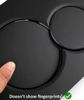Close-up of Jet Black Gloss Dual Flush Actuator Plate for Concealed Cisterns, wall mount push button showing fingerprint resistance