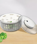 Game Changing Hella Big Electric Salad Spinner For Quick Lettuce Washing Knockout Battery Powered Produce Dryer smooth operation with visible lid and veggies.