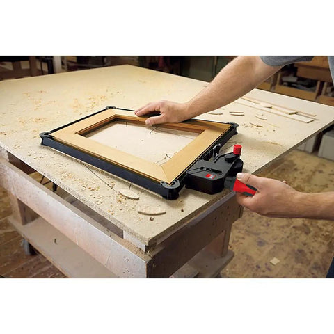 23 Ft Variable Angle Strap Clamp Kit with four pivoting Vario Clips in use on a rectangular wooden frame on a workshop table.