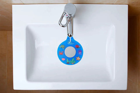 Slick Silicone Bathtub Drain Stopper shown in a bathtub, featuring vibrant ocean-themed designs, BPA free material.