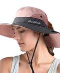 Woman wearing Women's Ponytail Safari Sun Hat With Wide Brim And UV 50 Protection Foldable Outdoor Bucket Style