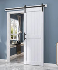 32 By 84 Inch White Barn Door With Five And A Half Foot Sliding Door Hardware Kit Included And Handle Solid Wood Covered With Waterproof PVC Surface Easy DIY Assembly And Install H Frame Fits Twenty Eight To Thirty Inch Wide Opening shown installed in a room