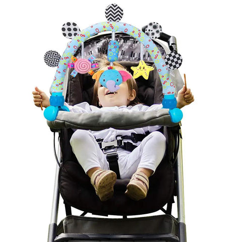 Travel Arch Bassinet Toy Clip On Stroller Toy For Infants And Toddlers Crib Accessory And Pram Activity Bar in use by a child