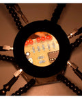Third Hand Soldering Tool With 6 Flexible Arms Helping Hands for PCB work, showing magnified circuit board detail with clips